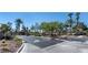 Street view of gated community entrance featuring desert landscaping, palm trees, and a decorative gate at 7250 Diamond Canyon Ln # 204, Las Vegas, NV 89149