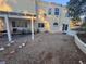 Exterior view of the house from the backyard featuring a pergola, patio, landscaping, and direct house access at 7509 Wheat Grass Ct, Las Vegas, NV 89129