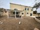 A spacious backyard with gravel, a covered patio, and desert landscaping at 7509 Wheat Grass Ct, Las Vegas, NV 89129