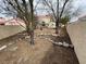 A spacious backyard with desert landscaping, featuring a fire pit area and stone accents at 7509 Wheat Grass Ct, Las Vegas, NV 89129