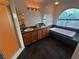 Bright bathroom with dual sinks, tub beneath decorative window, and shower at 7509 Wheat Grass Ct, Las Vegas, NV 89129