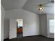 Bedroom with attached bathroom featuring a ceiling fan and vaulted ceiling at 7509 Wheat Grass Ct, Las Vegas, NV 89129