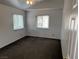 Bright bedroom showcasing neutral walls, natural light from the two windows, and plush carpeting at 7509 Wheat Grass Ct, Las Vegas, NV 89129