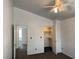 Bedroom featuring an ensuite bathroom, standard closet, and a lighted ceiling fan at 7509 Wheat Grass Ct, Las Vegas, NV 89129