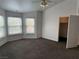 Bright bedroom featuring a walk-in closet and multiple windows for natural light at 7509 Wheat Grass Ct, Las Vegas, NV 89129