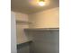 Walk-in closet with built-in shelving and ample storage space at 7509 Wheat Grass Ct, Las Vegas, NV 89129