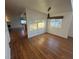 Dining area boasts wood flooring and natural light, with a view into the kitchen and living area at 7509 Wheat Grass Ct, Las Vegas, NV 89129