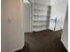 Spacious upstairs hallway featuring an open staircase, built-in shelving, and natural light at 7509 Wheat Grass Ct, Las Vegas, NV 89129