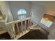 Upper hallway view with hardwood floors and staircase, showcasing natural light from adjacent windows at 7509 Wheat Grass Ct, Las Vegas, NV 89129