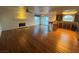 Open-concept living room features a fireplace and hardwood floors, connecting to a modern kitchen at 7509 Wheat Grass Ct, Las Vegas, NV 89129