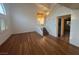 Inviting living room with hardwood floors and staircase featuring natural light at 7509 Wheat Grass Ct, Las Vegas, NV 89129