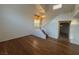 Bright living room showcasing hardwood floors, high ceilings, and a staircase at 7509 Wheat Grass Ct, Las Vegas, NV 89129