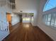 Inviting living room featuring hardwood floors and a staircase with natural light at 7509 Wheat Grass Ct, Las Vegas, NV 89129