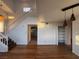 Bright living room featuring an open staircase, hardwood floors, and neutral paint at 7509 Wheat Grass Ct, Las Vegas, NV 89129