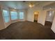 Comfortable main bedroom featuring bay windows, neutral carpeting, and an ensuite bathroom and closet at 7509 Wheat Grass Ct, Las Vegas, NV 89129