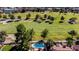 Aerial view of a home featuring a sparkling blue kidney-shaped pool and adjacent golf course at 7685 Spanish Bay Dr, Las Vegas, NV 89113