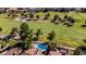 Aerial view of a home featuring a sparkling blue kidney-shaped pool and adjacent golf course at 7685 Spanish Bay Dr, Las Vegas, NV 89113