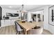 Stylish dining room featuring modern lighting, dining table, and decor with an open view to the kitchen at 7685 Spanish Bay Dr, Las Vegas, NV 89113