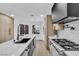 Bright kitchen featuring modern stainless steel appliances, marble countertops, and beautiful light wood cabinetry at 7685 Spanish Bay Dr, Las Vegas, NV 89113