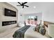 Bright main bedroom features a sliding glass door, a modern fireplace, and light wood accents at 7685 Spanish Bay Dr, Las Vegas, NV 89113