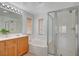 Bathroom featuring double sinks, soaking tub, and glass-enclosed shower at 8027 Anasazi Ranch Ave, Las Vegas, NV 89131