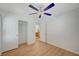 Bedroom featuring laminate wood flooring, ceiling fan, and closet at 8027 Anasazi Ranch Ave, Las Vegas, NV 89131