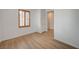 Neutral bedroom offers wood floors and a shuttered window at 8027 Anasazi Ranch Ave, Las Vegas, NV 89131