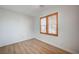 Bedroom featuring wood floors and natural light through shuttered windows at 8027 Anasazi Ranch Ave, Las Vegas, NV 89131