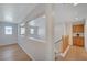 Upstairs hallway with wood floors, railing, and storage cabinet at 8027 Anasazi Ranch Ave, Las Vegas, NV 89131