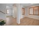 Spacious living room with wood-look floors and shuttered windows for natural light at 8027 Anasazi Ranch Ave, Las Vegas, NV 89131