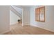 Open living area featuring wood-look floors, white walls, and a staircase at 8027 Anasazi Ranch Ave, Las Vegas, NV 89131