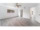 Large bedroom with light gray flooring, ceiling fan and natural light at 804 Vincent Way, Las Vegas, NV 89145