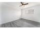 An empty bedroom shows a ceiling fan, wood-look floors, and a window at 804 Vincent Way, Las Vegas, NV 89145