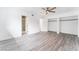 Light filled bedroom with a ceiling fan, wood-look floors, and closets with sliding doors at 804 Vincent Way, Las Vegas, NV 89145