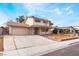 Two-story home featuring a two-car garage, long driveway, and desert-style landscaping at 804 Vincent Way, Las Vegas, NV 89145