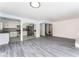 This open living area showcases contemporary flooring and an open layout to the kitchen at 804 Vincent Way, Las Vegas, NV 89145