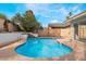 Lush backyard featuring a sparkling in-ground pool and spa perfect for enjoying the outdoors at 804 Vincent Way, Las Vegas, NV 89145