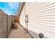 Side yard featuring concrete pavers, the home's vinyl siding, and a block wall at 804 Vincent Way, Las Vegas, NV 89145