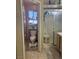 Bright bathroom featuring a toilet, vanity, and walk-in shower with glass doors at 807 Zinnia Cir, Henderson, NV 89015