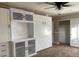 Bedroom featuring built-in cabinets and a Murphy bed adjacent to a closet with sliding doors at 8212 Cabin Springs Ave, Las Vegas, NV 89131