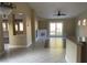 Bright living room featuring tile floors, recessed lighting, a ceiling fan and sliding glass doors to the backyard at 8212 Cabin Springs Ave, Las Vegas, NV 89131