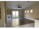 Bright living room featuring tile floors, recessed lighting, a ceiling fan and sliding glass doors to the backyard at 8212 Cabin Springs Ave, Las Vegas, NV 89131