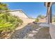 Beautiful backyard featuring desert landscaping and a cozy fire pit area at 9204 Gentle Cascade Ave, Las Vegas, NV 89178