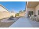 Outdoor patio area with a fire pit and seating, perfect for entertaining in the backyard at 9204 Gentle Cascade Ave, Las Vegas, NV 89178