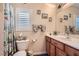 Cozy bathroom features a single sink, tiled shower, and decorated walls at 9204 Gentle Cascade Ave, Las Vegas, NV 89178