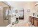 Bright bathroom features a soaking tub, glass shower, and double sink vanity at 9204 Gentle Cascade Ave, Las Vegas, NV 89178