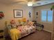 Cozy bedroom showcasing a floral motif with a decorative bed frame and bright window at 9204 Gentle Cascade Ave, Las Vegas, NV 89178