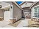 A close-up of the gated front entrance with stonework accents and a two-car garage at 9204 Gentle Cascade Ave, Las Vegas, NV 89178