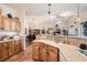 Open kitchen featuring modern appliances, a breakfast bar, and seamless access to the living areas at 9204 Gentle Cascade Ave, Las Vegas, NV 89178