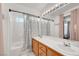 Bright bathroom with double vanity, white countertop, and shower-tub combination at 9564 Belle Fountain Ave, Las Vegas, NV 89123